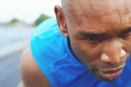 man sweating outdoors